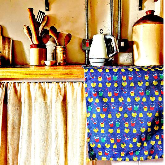 buckets and spades seaside tea towel organic cotton kitchen cloth , designed and made in Britain
