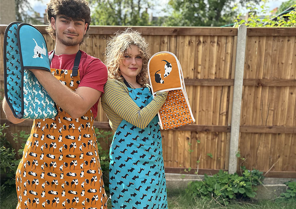 Cats and Dogs aprons and oven gloves worn by models