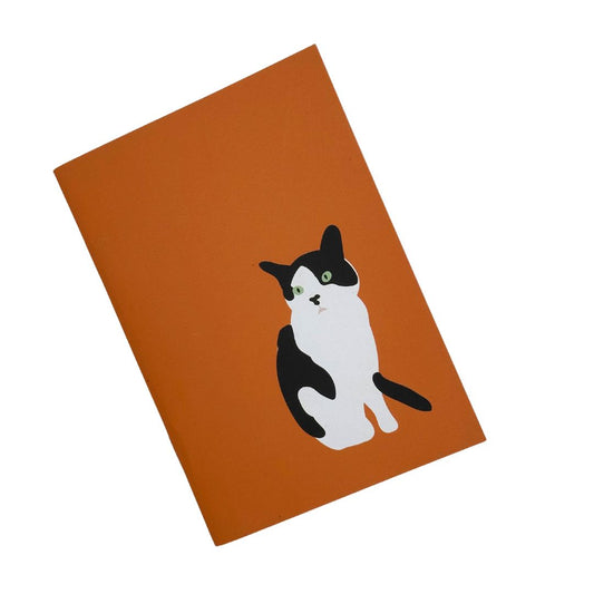 Orange Cat a6 notebook 36 plain pages. made with recycled paper and printed with plant based dyes at a UK carbon neutral printers