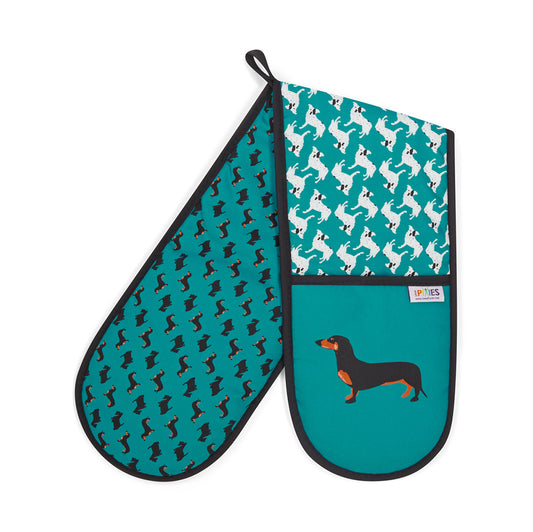 Bright petrol blue organic cotton oven mitts with illustrative dog design featuring dacshunds, scottish terriers and CC the wonder dog. Shown here on a plain white background