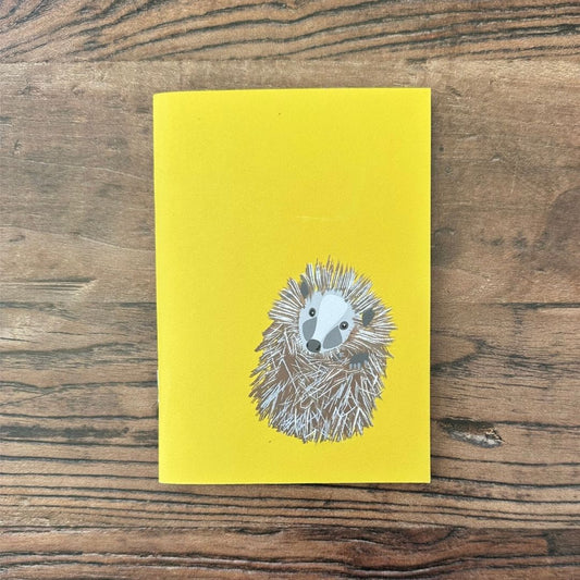 Hedgehog notebook front cover on wooden table
