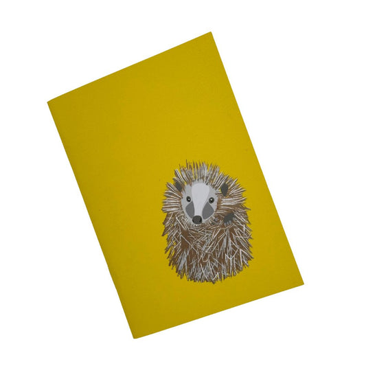 Hedgehog yellow pocket sized notebook with 36 plain pages printed with plant based inks on recycled paper at a local carbon neutral printers