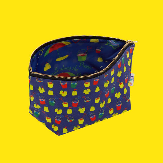 Seaside Really Useful Bag, buckets and spades on the organic cotton outer, seaside scenes on the waterproof lining