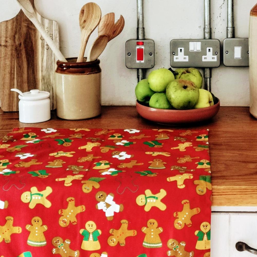 Gingerbread Folk Tea Towel in organic Cotton from UmmPixies. Designed and made in the UK