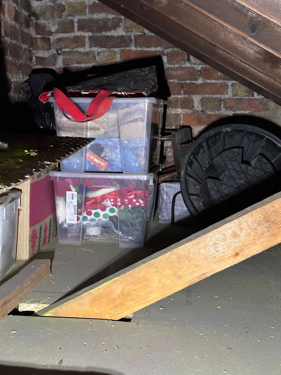 Boxes of Christmas decorations in a dusty attic