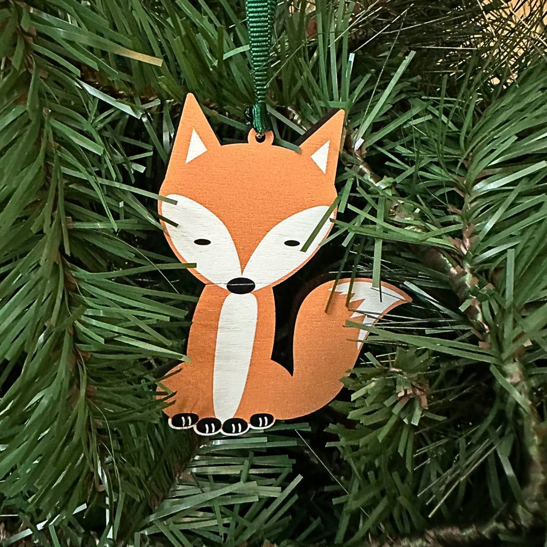 cute fox hanghing decoration shown in a Christmas tree