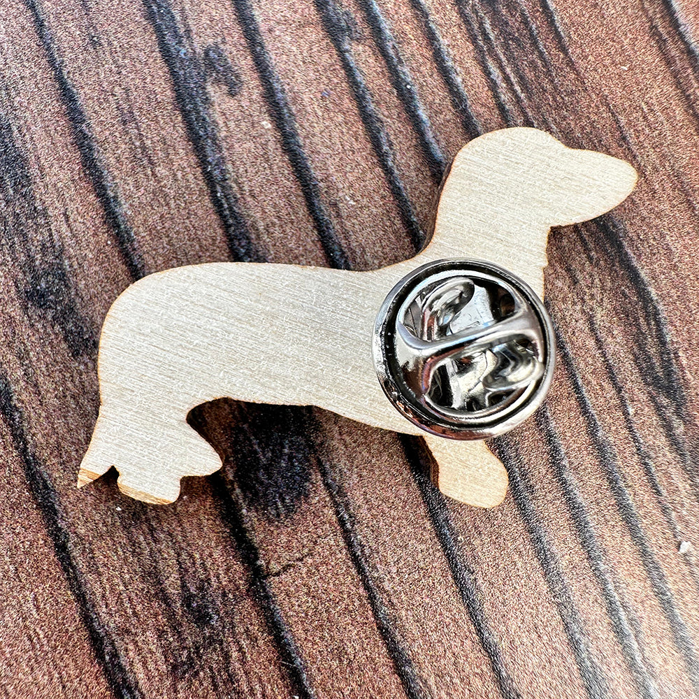 Black and Tan shorthair Dachshund  pin badge showing the reverse