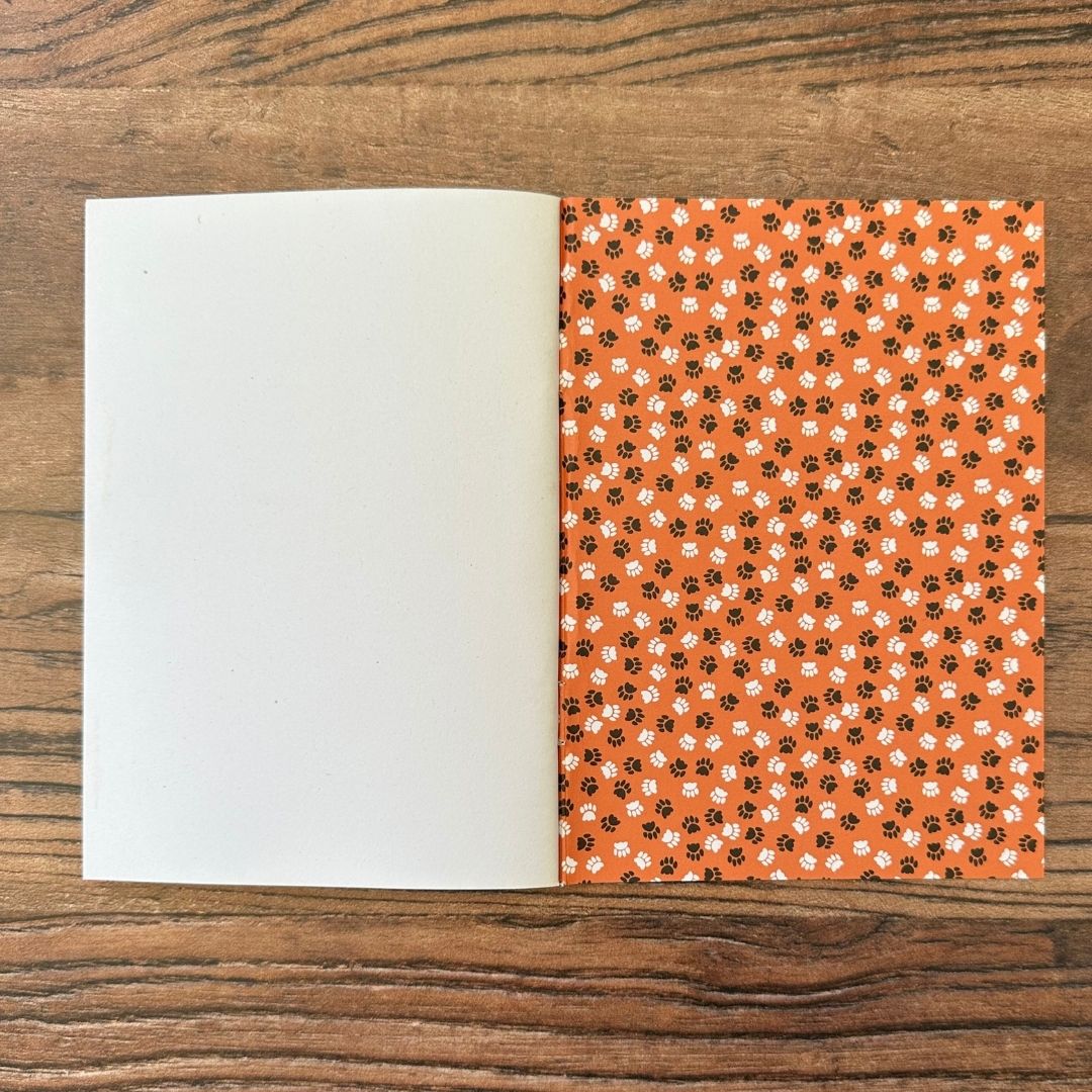 detail of the Inside back cover of cat pocket notebook showing paw print design detail