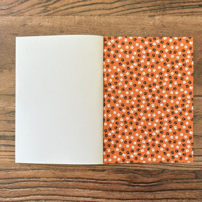 detail of the Inside back cover of cat pocket notebook showing paw print design detail
