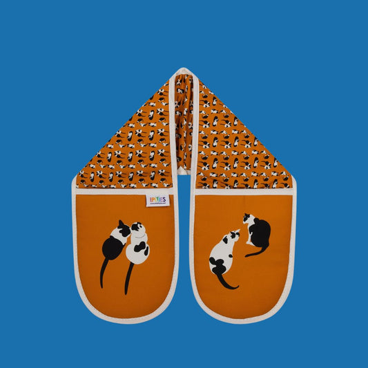 UmmPixies Orange Organic Cotton Cats double oven gloves shown on a blue background 