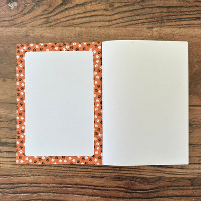 detail of the Inside front cover of cat pocket notebook showing indexing space and paw print design detail