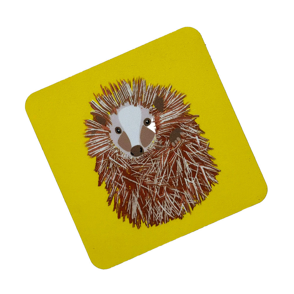 curled up hedgehog  illustration on bright yellow coaster from UmmPixies