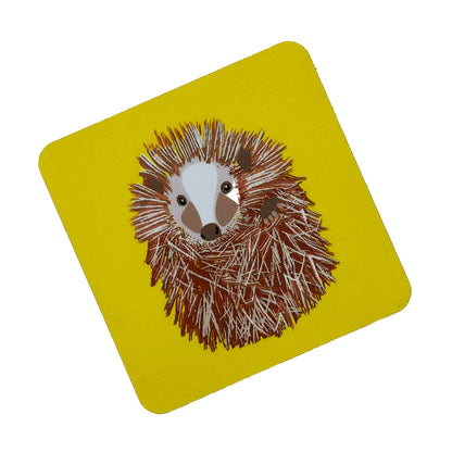 curled up hedgehog  illustration on bright yellow coaster from UmmPixies