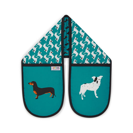 Bright petrol blue organic cotton oven mitts with illustrative dog design featuring dacshunds, scottish terriers and CC the wonder dog. Shown here on a plain white background