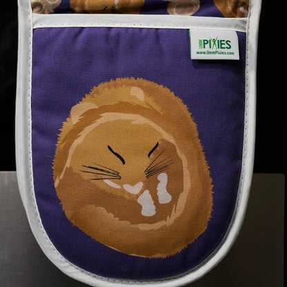 Oven mitt with a sleeping hazel dormouse design and UmmPixies branding.