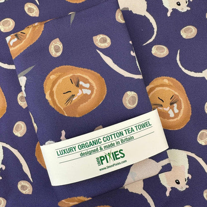 Luxury organic cotton tea towel with dormouse design on a purple background