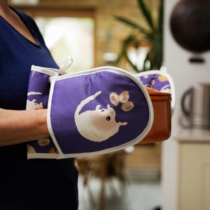 dormouse oven gloves shown being used by person carrying casserole dish