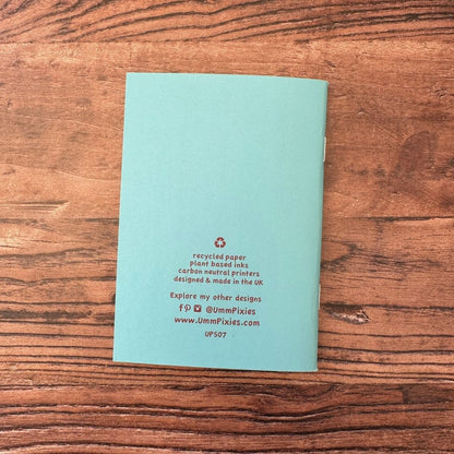 back cover of mandarin duck notebook on wooden table