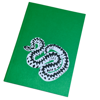 Green notebook with a snake illustration on a white background
