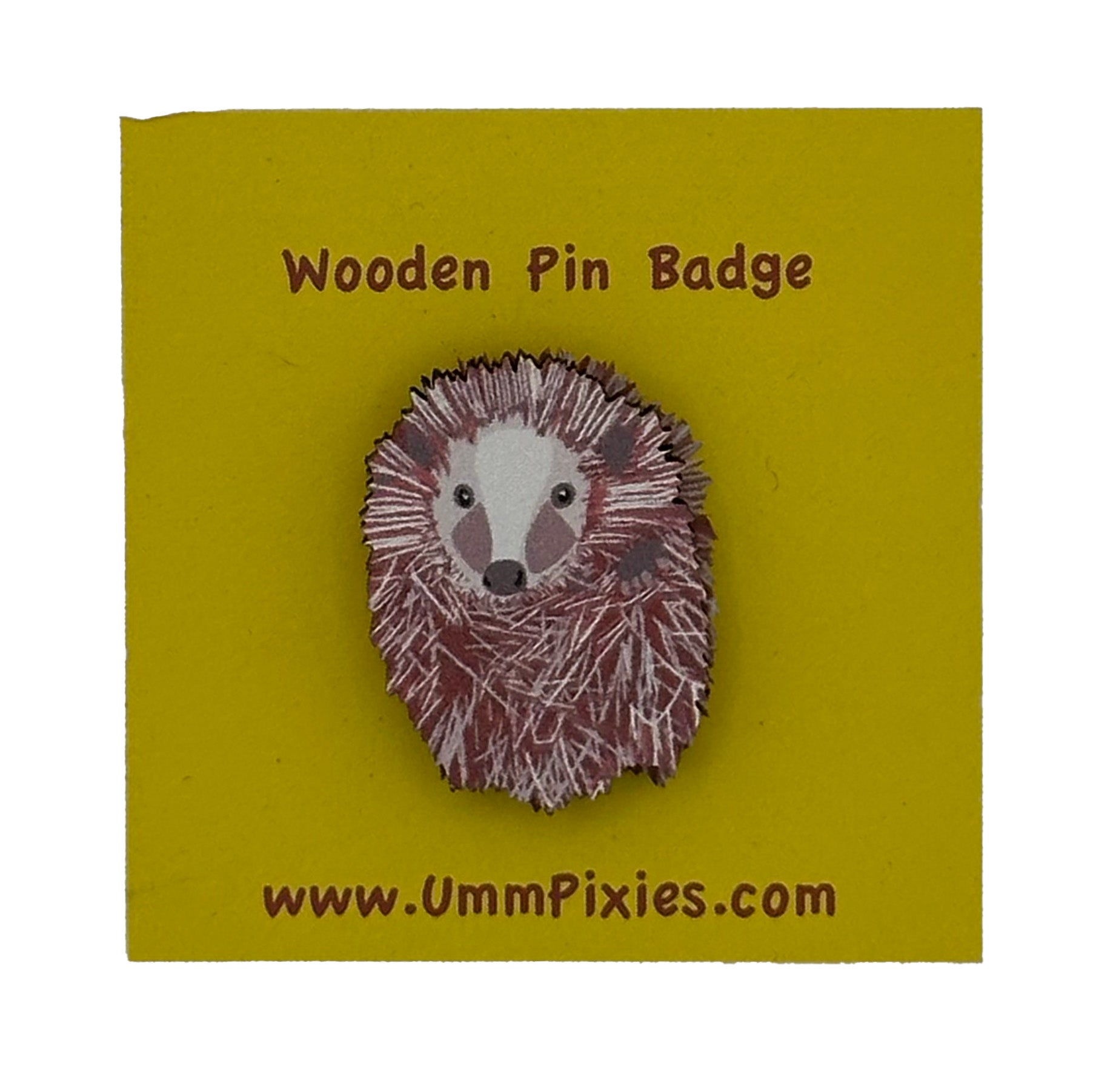 hedgehog wooden pin badge shown on display card
