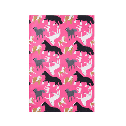 Pattern of horses on a pink cotton tea towel