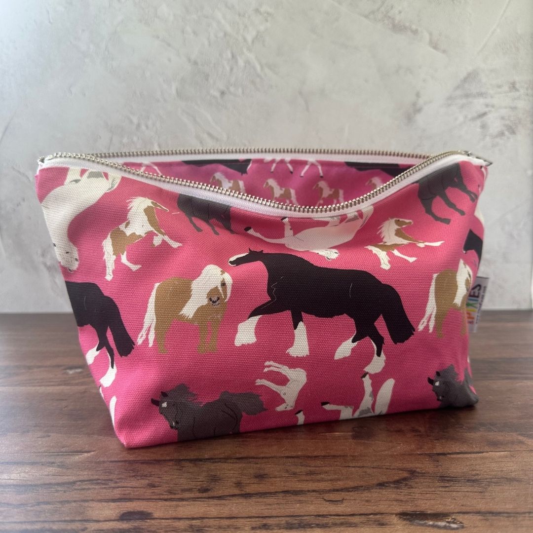Pink Horses illustrated really useful bag shown open with waterproof printed lining visible
