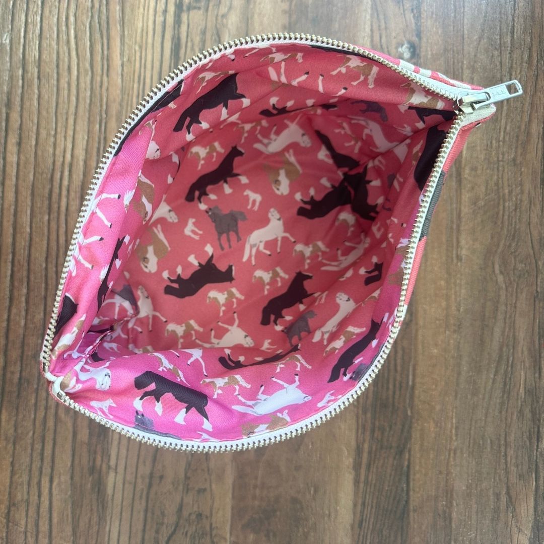 Pink Horses illustrated really useful bag shown from above open with waterproof printed lining visible