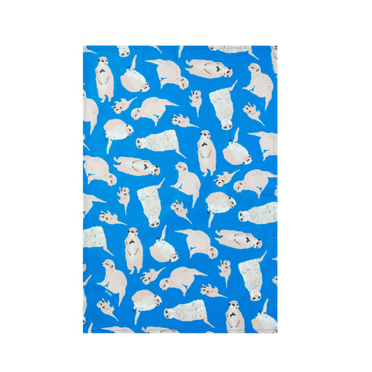 Blue kitchen tea towel with meerkat illustrations shown laid flat on a white background