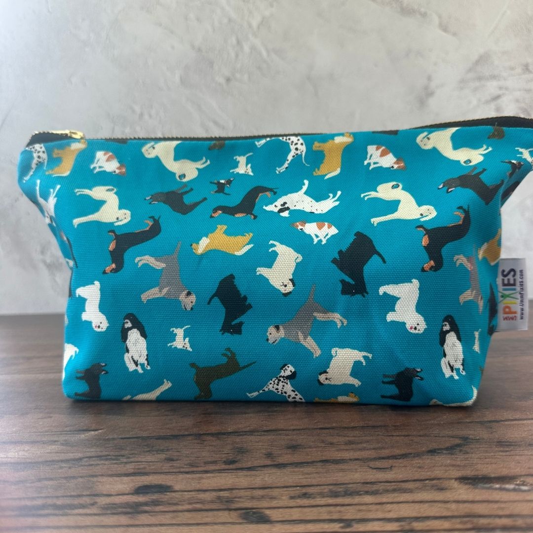 Petrol Blue Dogs illustrated really useful bag shown zipped shut on wooden surface