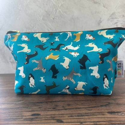 Petrol Blue Dogs illustrated really useful bag shown zipped shut on wooden surface