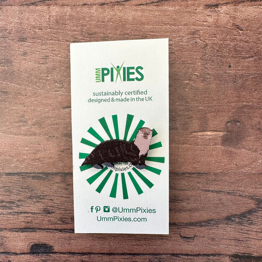 Otter badge shown on its retail packaging display Card 