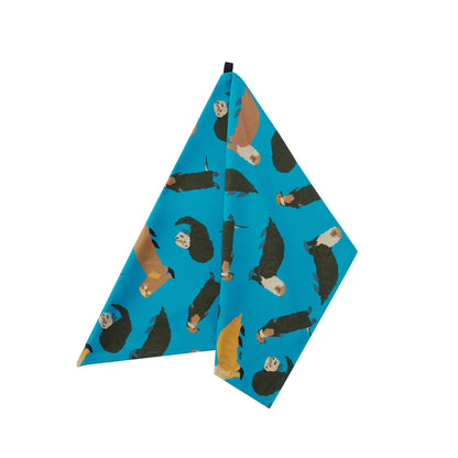 Petrol blue tea towel with otters design