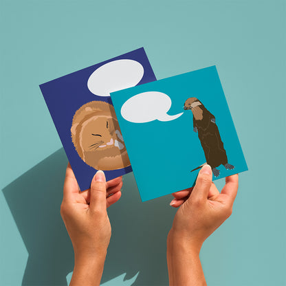 hands holding an otter and a dormouse greetings card