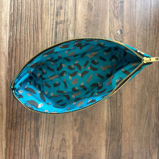 Petrol Blue Otters illustrated really useful bag shown from above with zip open and waterproof printed lining visible