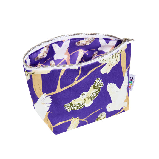 Purple zipped pouch with owl pattern shown open revealing printed waterproof lining