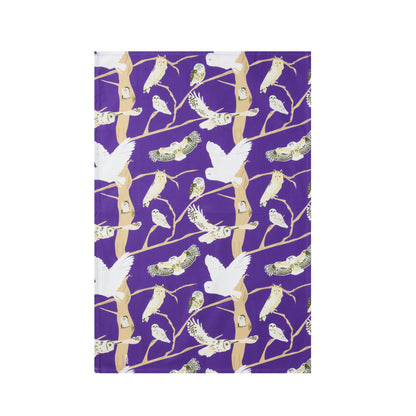 Purple kitchen towel featuring illustrations of 5 native owls to the British isles 
