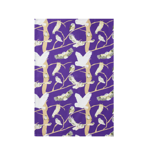 Purple kitchen towel featuring illustrations of 5 native owls to the British isles 