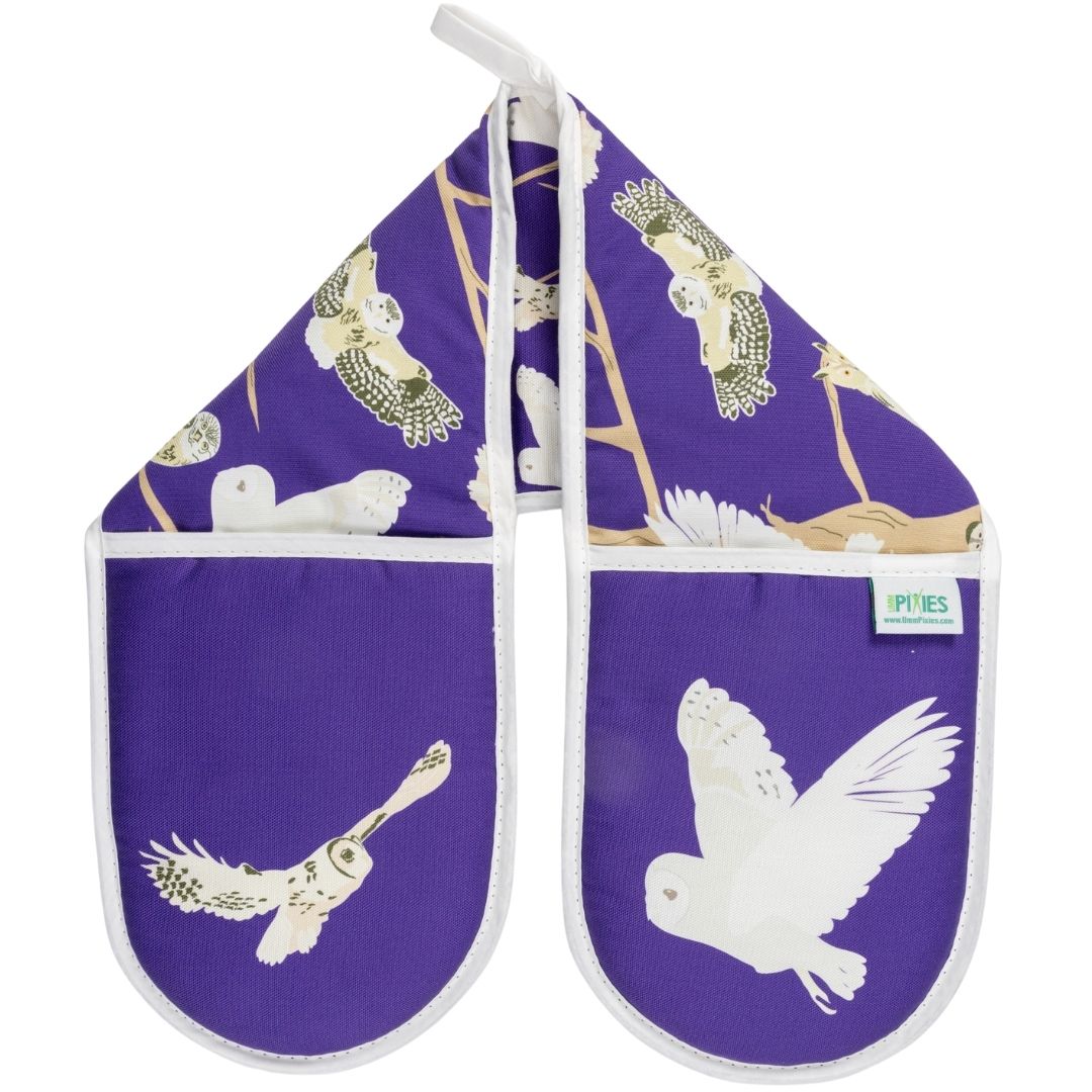 Purple oven gloves with pattern featuring the 5 species of native British owls including barn owl. tawny owl and more, shown on a white background