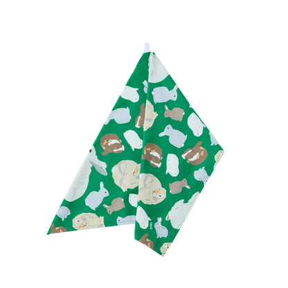 Green organic cotton tea towel with rabbits design shown hanging using loop t on a white background