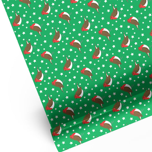 Green wrapping paper with repeating pattern of robin redbreasts and white stars