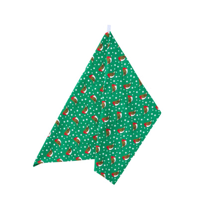 Green kitchen towel with festive robins and stars pattern on a white background