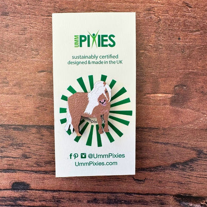 Shetland Pony wooden pin badge on display card on wooden table