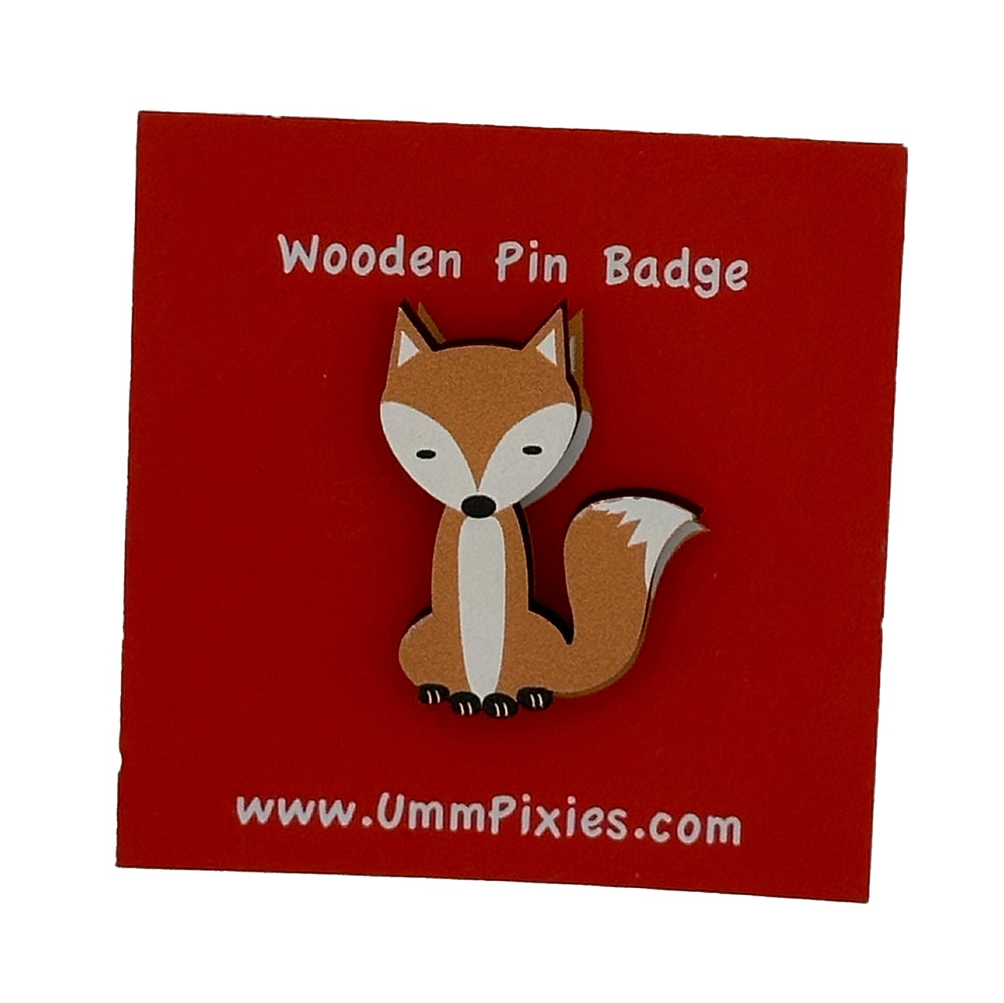 Sitting Fox Wooden pin badge shown on display card