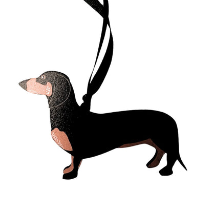 Black and tan dachshund ornament on a white background