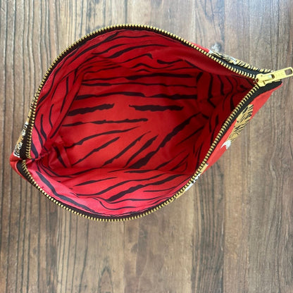 Bright Red Sumatran Tiger  really useful bag shown from above with zip open revealing the tiger stripe printed waterproof lining