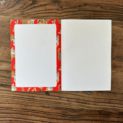 inside front cover of tiger design pocket notebook 