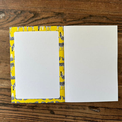 inside front cover of yellow zebra design pocket notebook 