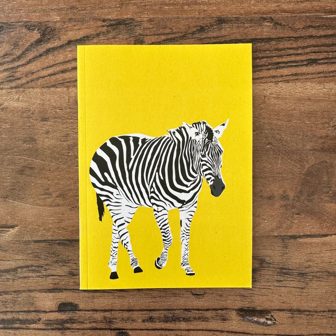 front cover of yellow zebra design pocket notebook 