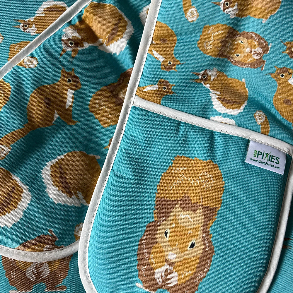 red squirrel oven gloves shown in packing box