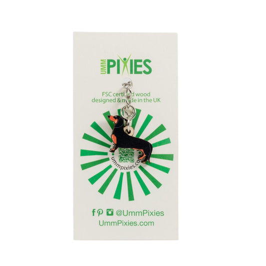 Umm Pixies Black & Tan Dachshund wooden charm keyring on a branded card with green and white design